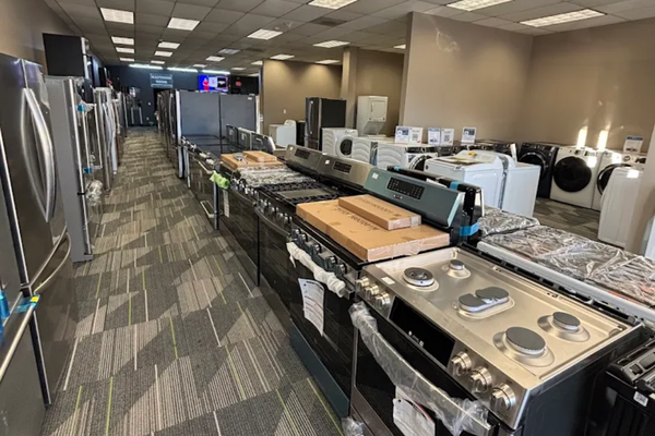 Inside City Appliance & Mattress Outlet showroom with appliance inventory